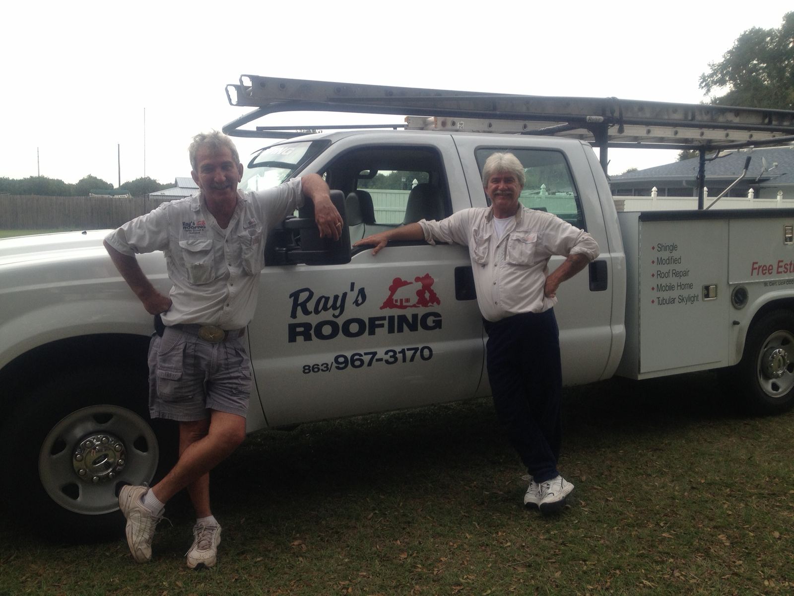 Gary and Terry Ray with a Ray's Roofing truck